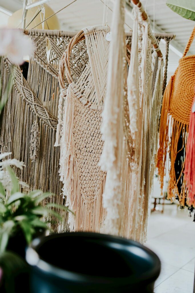 Stylish handmade macrame decorations hanging indoors with chic bohemian style.